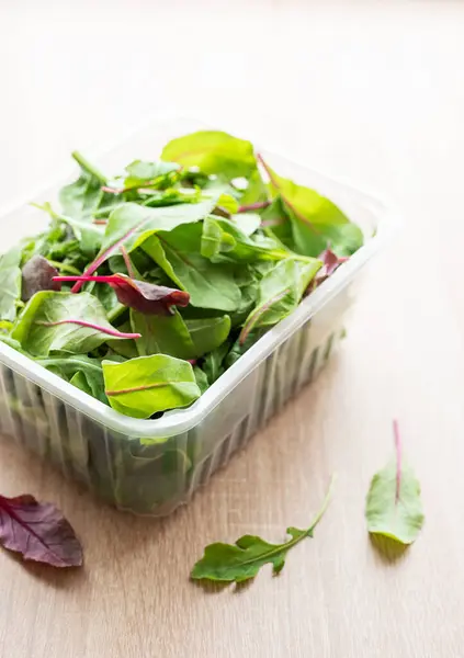 Salad mix in a box.  Fresh mixed salad leaves in plastic container