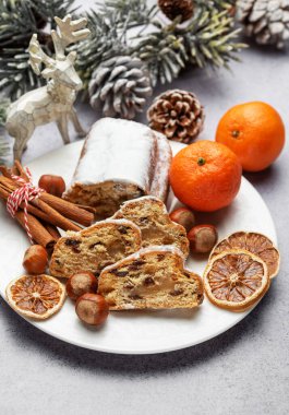 Traditional  stollen fruit cake. Christmas stollen with winter holidays decoratio clipart