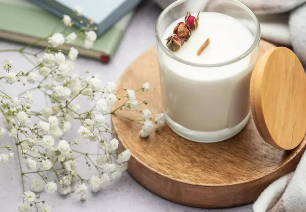 Aromatic candle on the table.  Soy candles  in a jar. Aromatherapy and relax in spa and home. Still life.