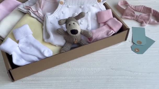 Baby Child Clothes Knitted Toys Carton Box Donation Charity Concept — Stock Video