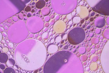 Liquid bubbles , macro bubbles in various colors, abstract backgrounds, oil beauty and science concept background