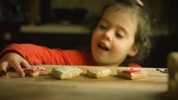 Film Damage Efect Girl Happily Eats Homemade Christmas Gingerbread Cookie — Stock Video