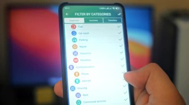 Caucasian male making a payment with bitcoins cryptocurrency using his smartphone. Custom application interface design. Light rays effect.