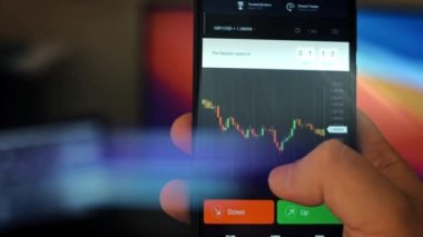 Caucasian male making a payment with bitcoins cryptocurrency using his smartphone. Custom application interface design. Light rays effect.