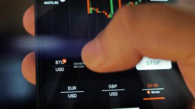 Caucasian male making a payment with bitcoins cryptocurrency using his smartphone. Custom application interface design. Light rays effect.