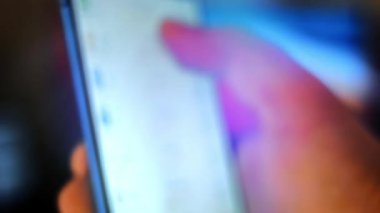Caucasian male making a payment with bitcoins cryptocurrency using his smartphone. Custom application interface design. Light rays effect.