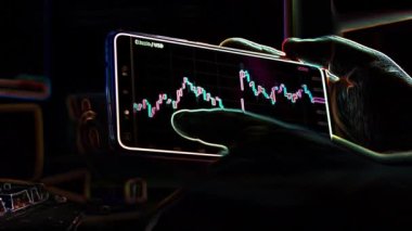 Bitcoin cryptocurrency price graph chart on mobile phone screen, cryptocurrency future price prediction concept, edge detect effect.