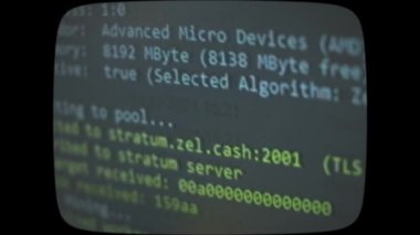 Cryptocurrency mining on a computer screen. The algorithm of the computer program on the monitor. Execution of the program code for the mining program. Pop-up lines of a computer program.