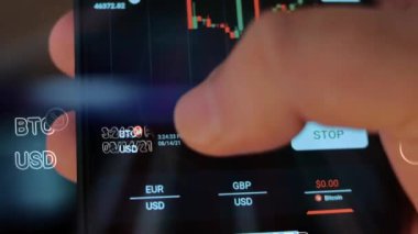 Caucasian male making a payment with bitcoins cryptocurrency using his smartphone. Custom application interface design. 4K UHD RAW edited footage