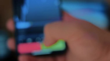 Caucasian male making a payment with bitcoins cryptocurrency using his smartphone. Custom application interface design. 4K UHD RAW edited footage