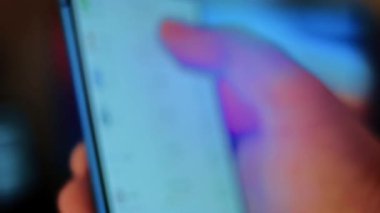 Caucasian male making a payment with bitcoins cryptocurrency using his smartphone. Custom application interface design. 4K UHD RAW edited footage