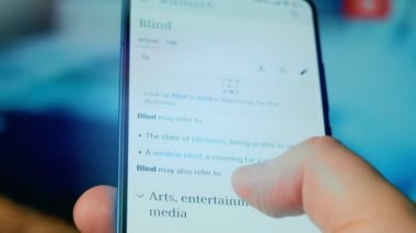 Looking at the smartphone, questions about the blind.