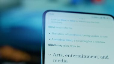 Looking at the smartphone, questions about the blind.