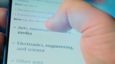 Looking at the smartphone, questions about the blind.