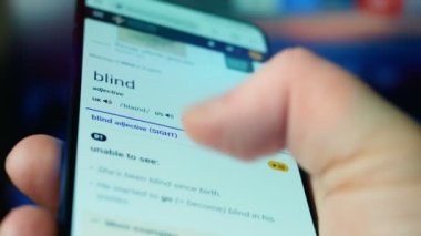 Looking at the smartphone, questions about the blind.