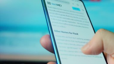 Looking at the smartphone, questions about gender fluid.