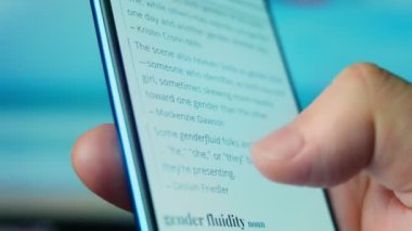 Looking at the smartphone, questions about gender fluid.