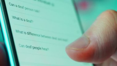 Looking at the smartphone, questions about the deaf.