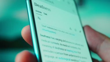 Looking at the smartphone, questions about the deaf.