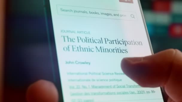 Looking Smartphone Read Information Minorities Politics — Stockvideo