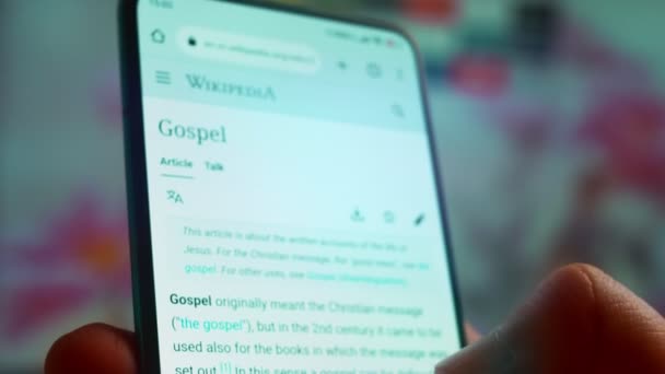 Looking Smartphone Read Information Gospel — Video Stock