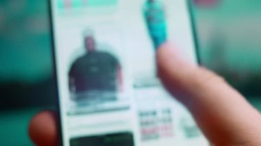 Smartphone in hand, macro view of the heavyset question.