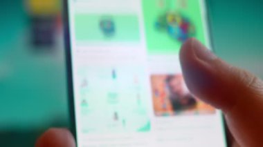 Smartphone in hand, looking for information about autism.