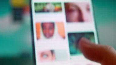 Smartphone in hand, looking for information about blindness.