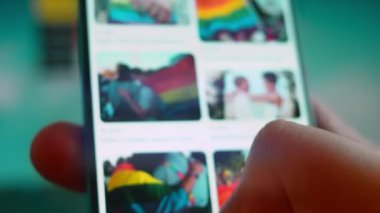 Smartphone in hand, looking for information about non binary.