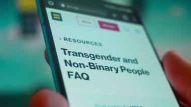 Smartphone in hand, looking for information about non binary.