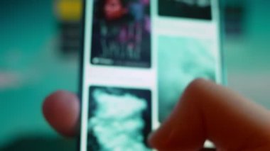 Smartphone in hand, looking for information about white smoke.