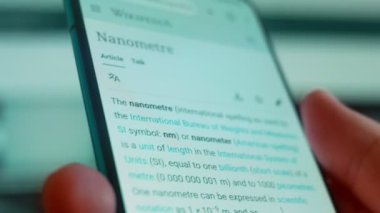 Smartphone in hand, looking for information about 8 mm.