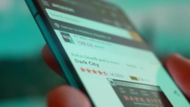 Smartphone in hand, Im looking for information on the internet about dark city.