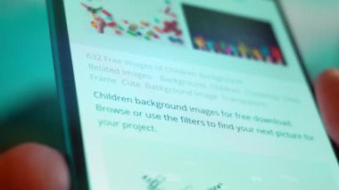 Smartphone in hand, Im looking for information on the Internet about childrens background.