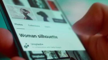 Smartphone in hand, Im looking for information on the internet about silhouette woman.