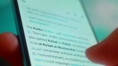 Smartphone in hand, Im looking for information on the Internet about the Kaaba.