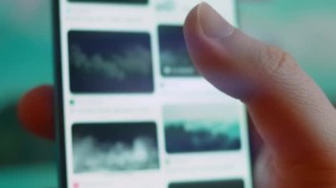 Smartphone in hand, looking for information about smoke fog.