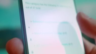 Smartphone in hand, looking for information about mixed fights.