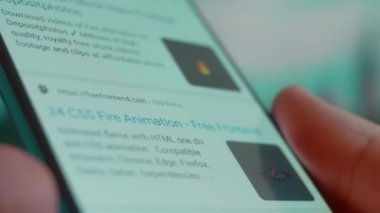 Smartphone in hand, looking for information about fire animation.