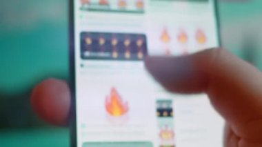 Smartphone in hand, looking for information about fire animation.