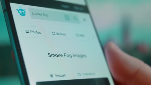 Smartphone Hand Looking Information Smoke Fog — Stockvideo