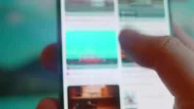 Smartphone in hand, looking for information about car moving.