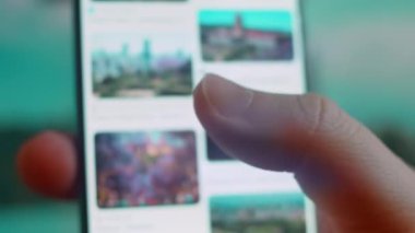 Smartphone in hand, looking for information about pretoria.