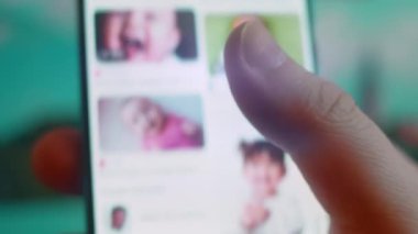 Smartphone in hand, looking for information about baby laughing.