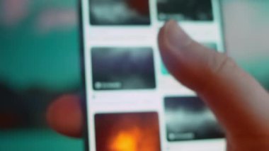 Smartphone in hand, looking for information about fog background.