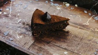 Hologram effect of Truffle cake on a wooden tray with decorations.