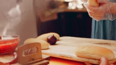 Process of preparing Irresistible chili cheese Hot Dogs. Taste USA cuisine.