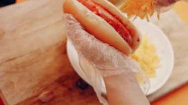 Process of preparing Irresistible chili cheese Hot Dogs. Taste USA cuisine.
