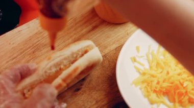 Process of preparing Irresistible chili cheese Hot Dogs. Taste USA cuisine.