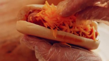 Process of preparing Irresistible chili cheese Hot Dogs. Taste USA cuisine.